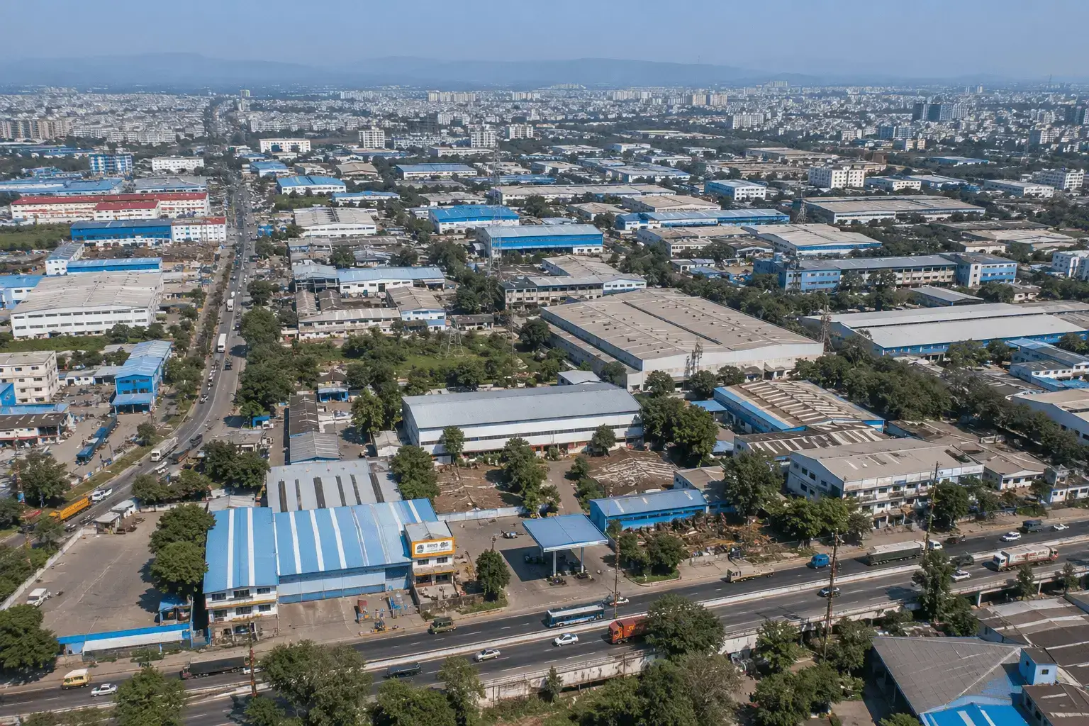 Aerial view of manufacturing facilities and modern infrastructure in the PCMC Industrial Corridor.